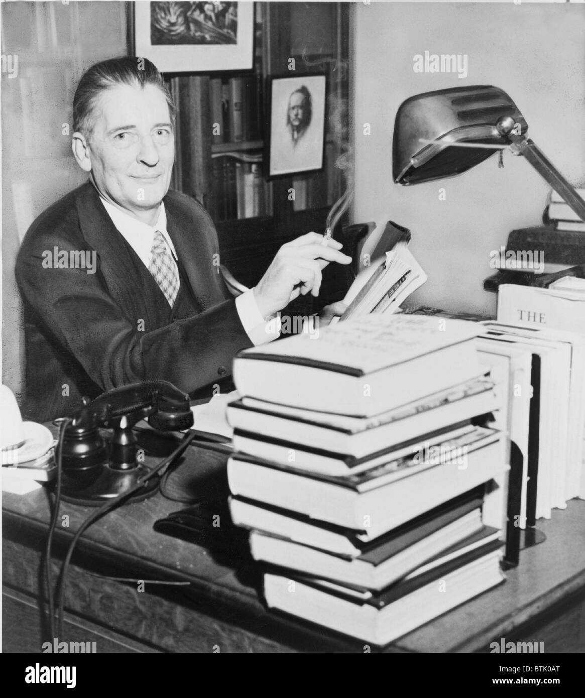 Maxwell Perkins (1884-1947) as an editor at Scribner's, he worked with great modern authors including F. Scott Fitzgerald, Hemingway, and Thomas Wolfe. 1943. Stock Photo