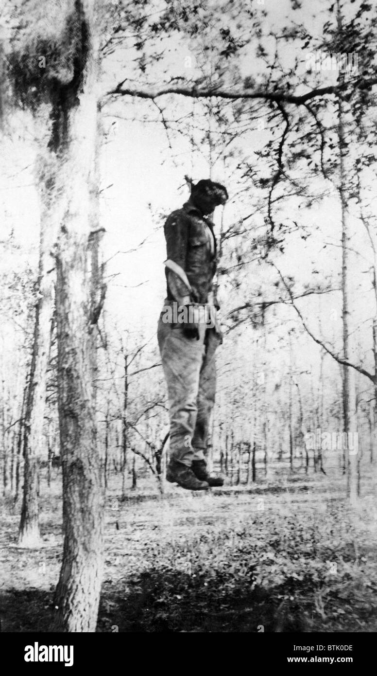 Lynching of Chandler Colding, an African American man charged with raping a 77 year woman. A masked mob of 250 men stormed the s Stock Photo