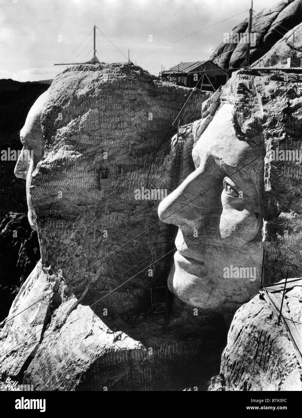 MOUNT RUSHMORE, operations to resume in April after halting for winter. View shows completed profiles of George Washington (l) a Stock Photo