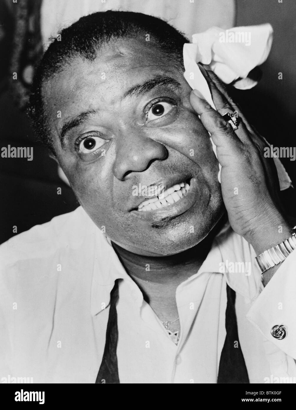 Louis Armstrong (1901-1971), African American Jazz musician, with his signature handkerchief in 1953. Stock Photo