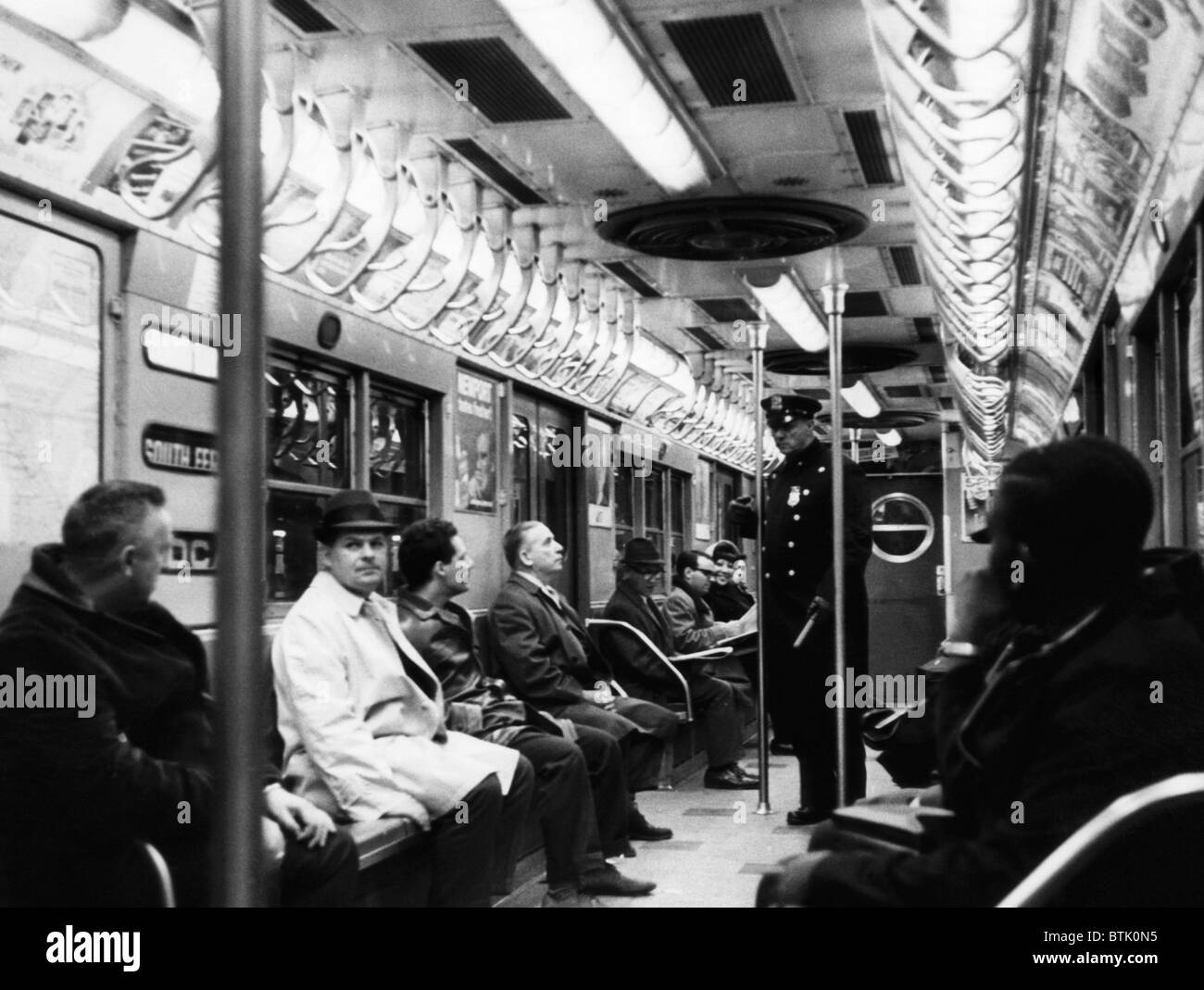 A New York City policeman patrols the subway. April 8, 1965. CSU Archives/Courtesy Everett Collection Stock Photo