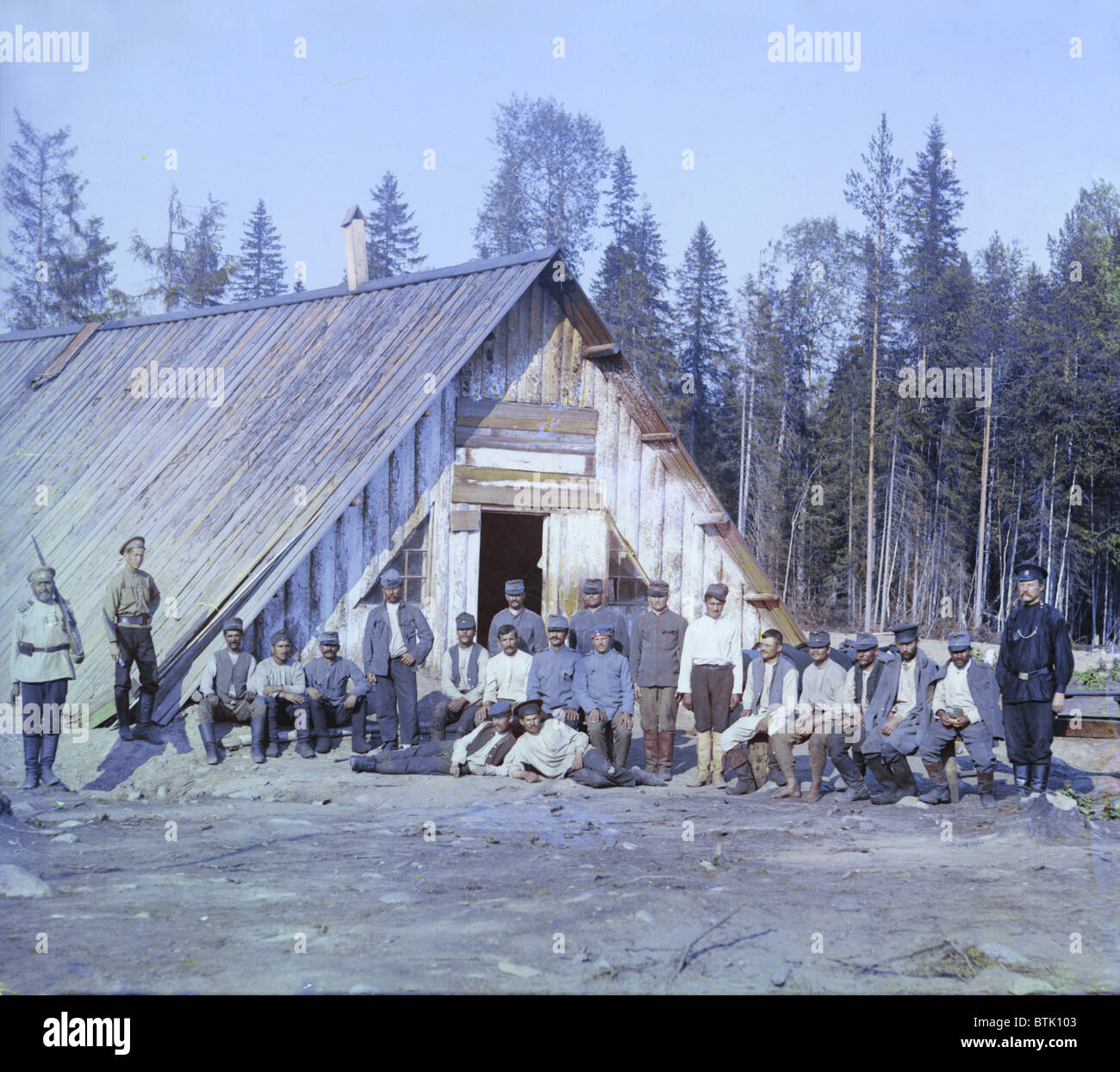 Austrian prisoners of war near a barrack, near Kiappeselga, original title: 'Voennopliennye avstri?itsy u baraka,' photograph by Sergei Mikhailovich Prokudin-Gorskii, 1915. Stock Photo