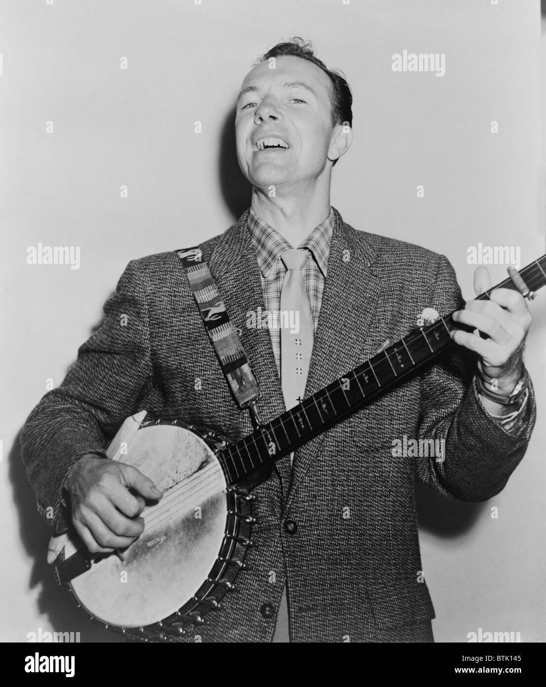 Pete Seeger (b. 1919) singing playing banjo. He wrote many classic folk songs popularized in the 1960s, including “Where Have All the Flowers Gone,” “If I Had a Hammer,” and “Turn, Turn, Turn.” Stock Photo