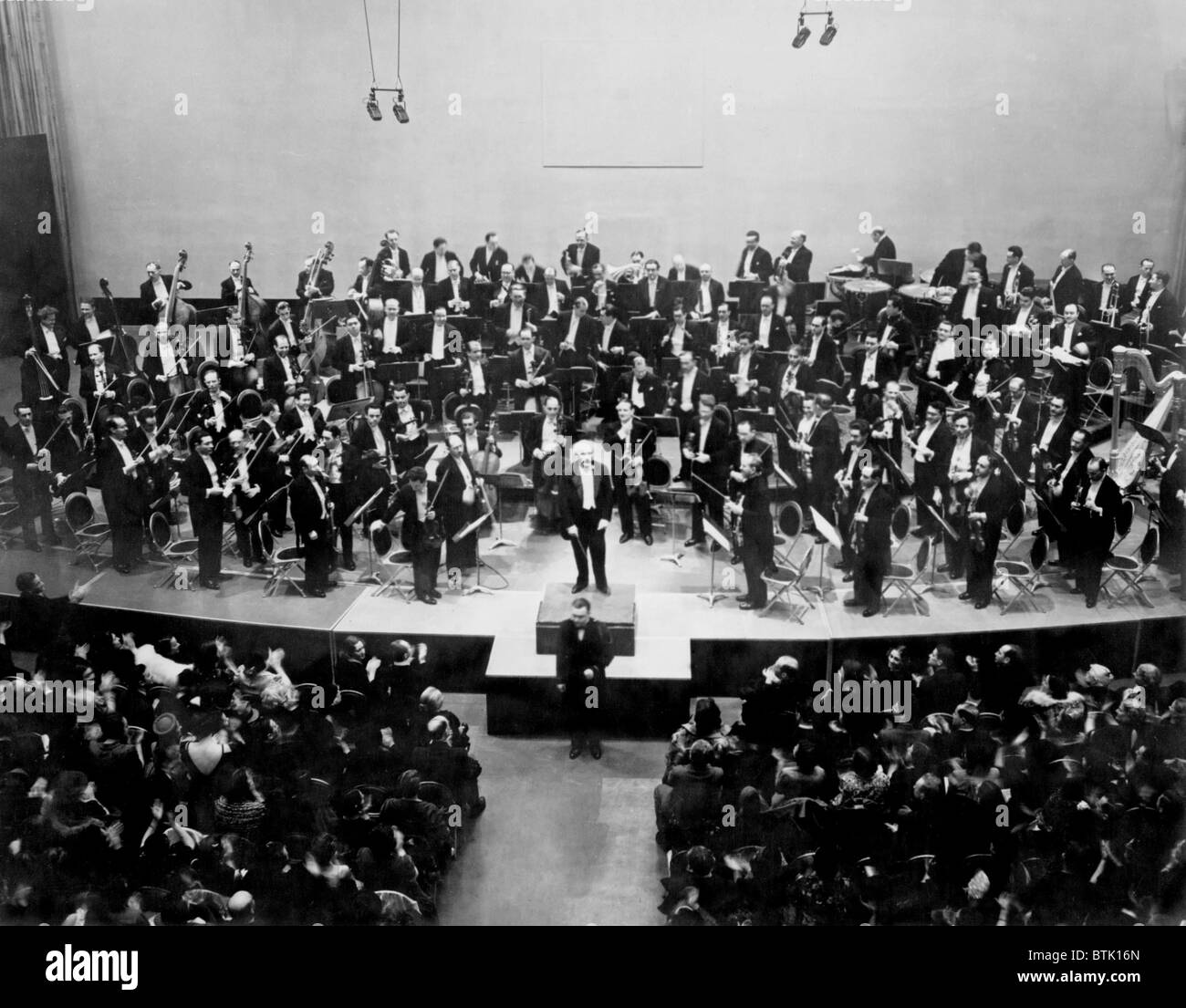 Arturo Toscanini (1867-1957) receives the applause at Radio City on March 5, 1938 at the conclusion of the broadcast of the NBC Stock Photo