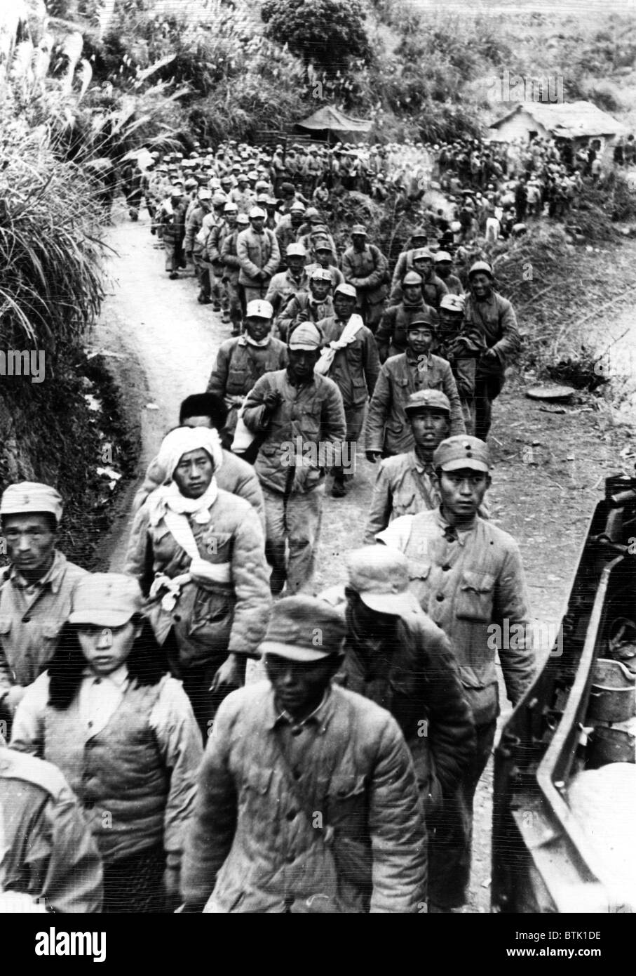 Nationalists surrender and are taken to interment camp, Saigon, Indo-China, 12-30-1949. Stock Photo