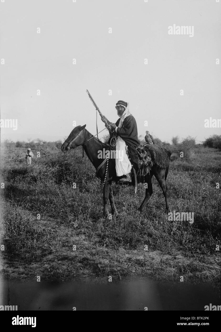 Bedouin hunter with his falcon, Jerusalem, photograph by American Colony Photo Department, 1898-1946 Stock Photo