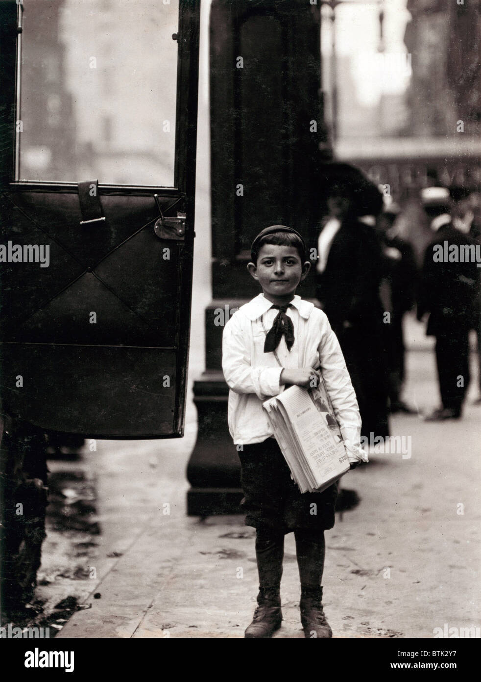 Newsboy, from original caption 'Dominick Carroll, 8 years old (appears