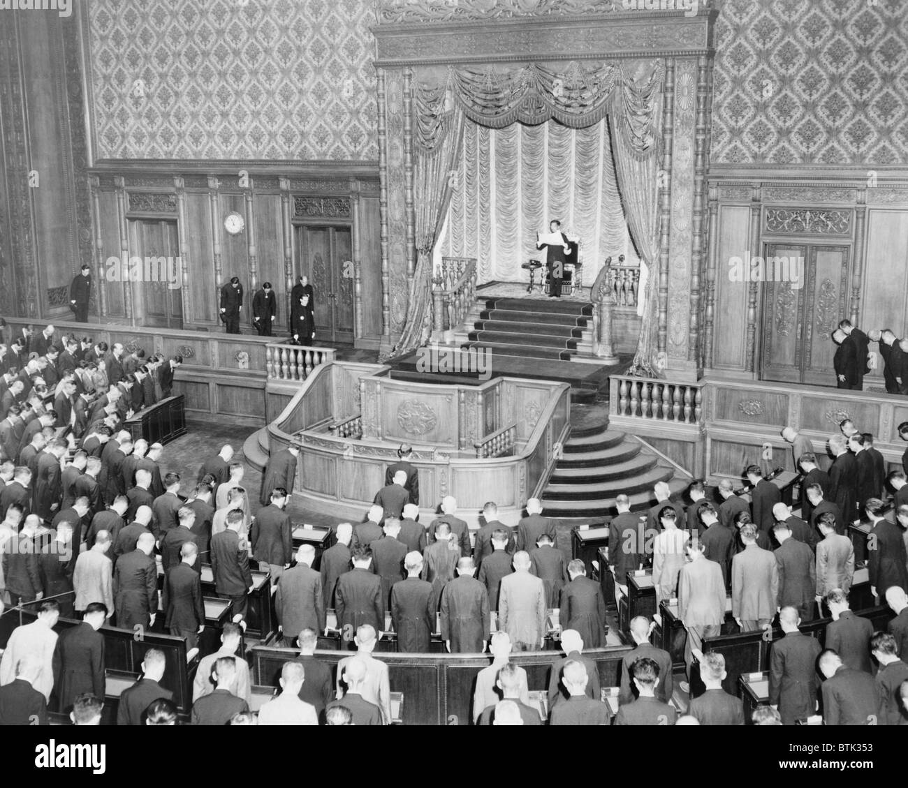 Emperor Hirohito (1901-1989) standing opening the 90th session of the Japanese Diet in June 20, 1946. Following World War II Hirohito assumed to role of a non-divine constitutional monarch. Stock Photo