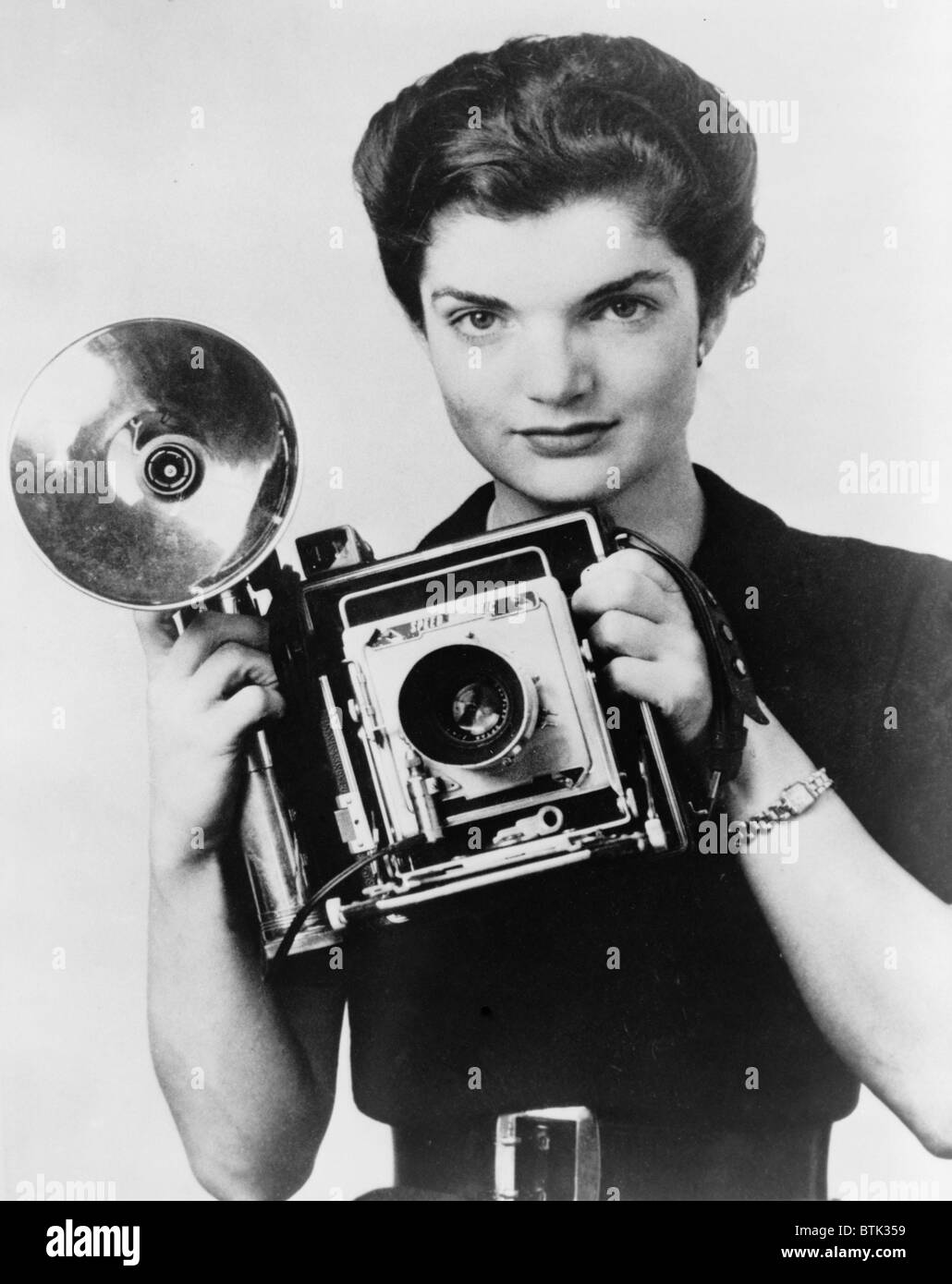 Jacqueline Bouvier as the 'Inquiring Camera Girl' of the Washington Times-Herald. 1952                                  hington Stock Photo