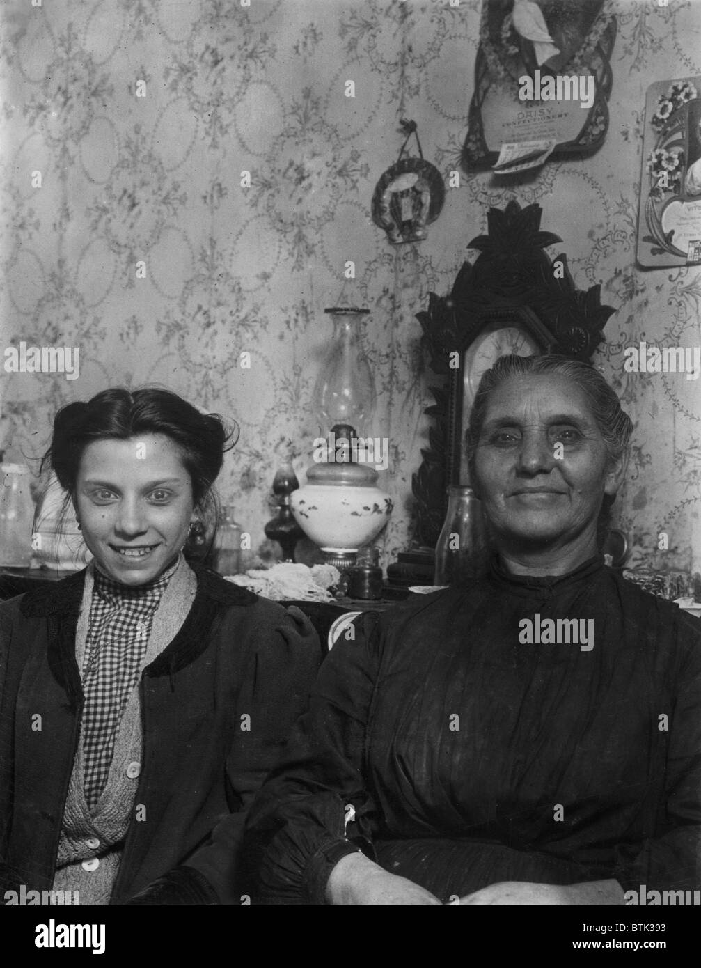 Clara Ladnica and mother, 241 West Genesee Street. Go fruit picking country in summer, Buffalo, New York, photograph by Lewis Wickes Hine, February, 1910 Stock Photo