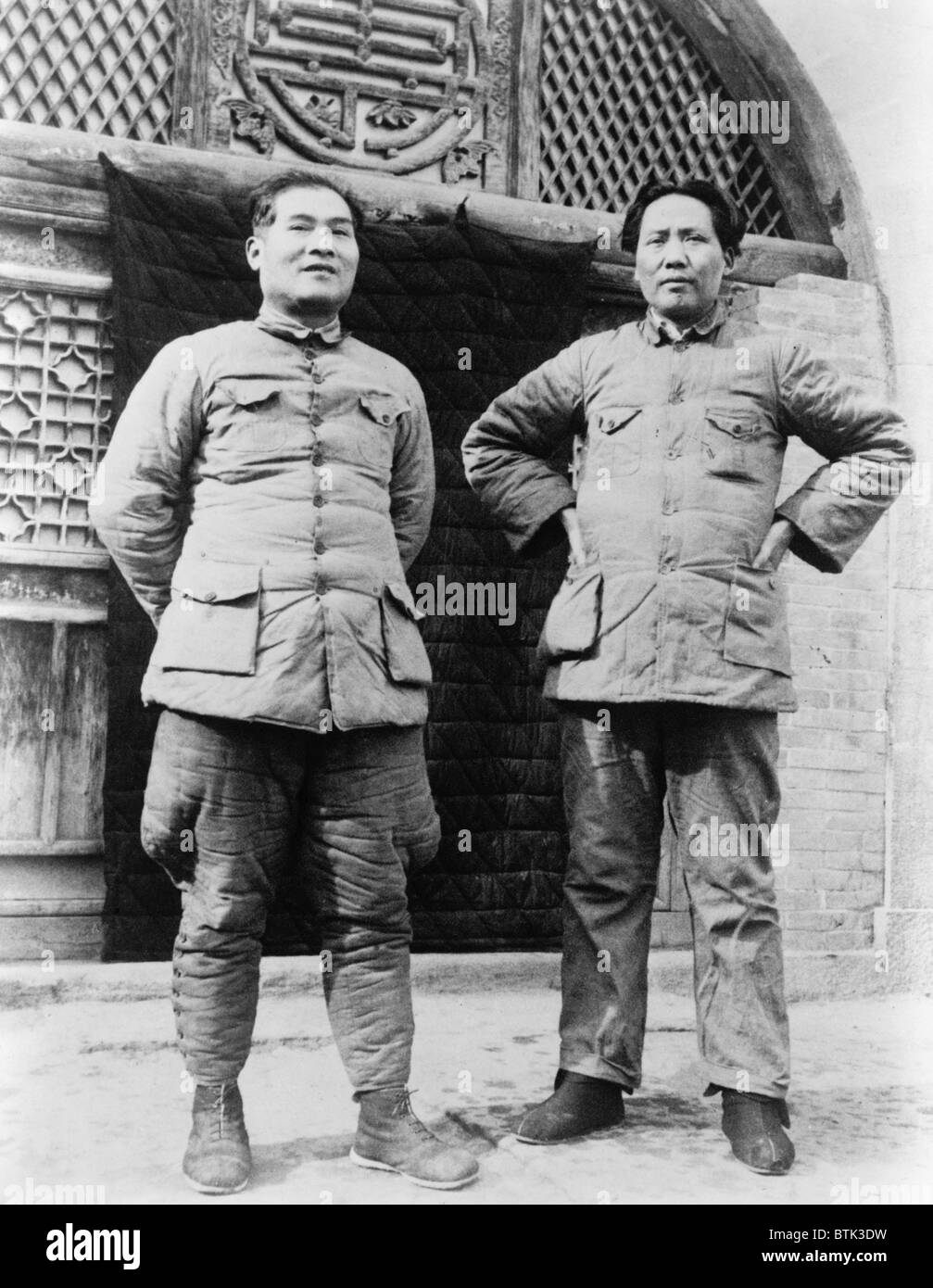 Mao Zedong (1893-1976) and Zhang Guotao (1897-1979), standing in courtyard of the supreme communist headquarters in China in the 1930s. Following the Long March, Zhang unsuccessfully challenged Mao for command of the Communist Army in 1935. Stock Photo