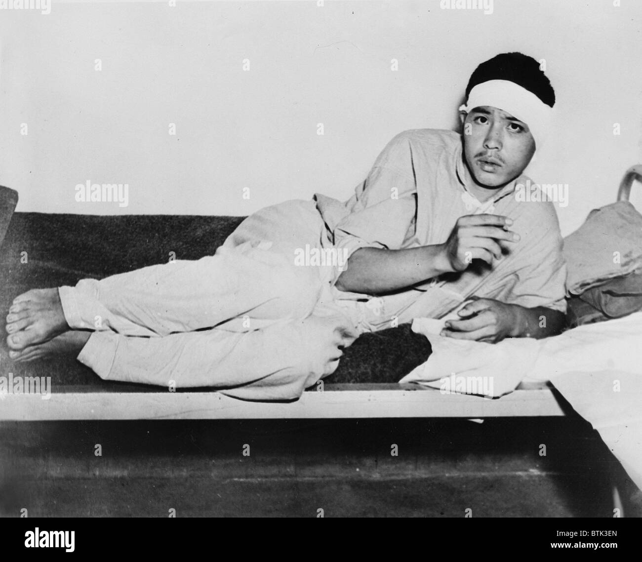 World War II, A Japanese prisoner smoking an American cigarette