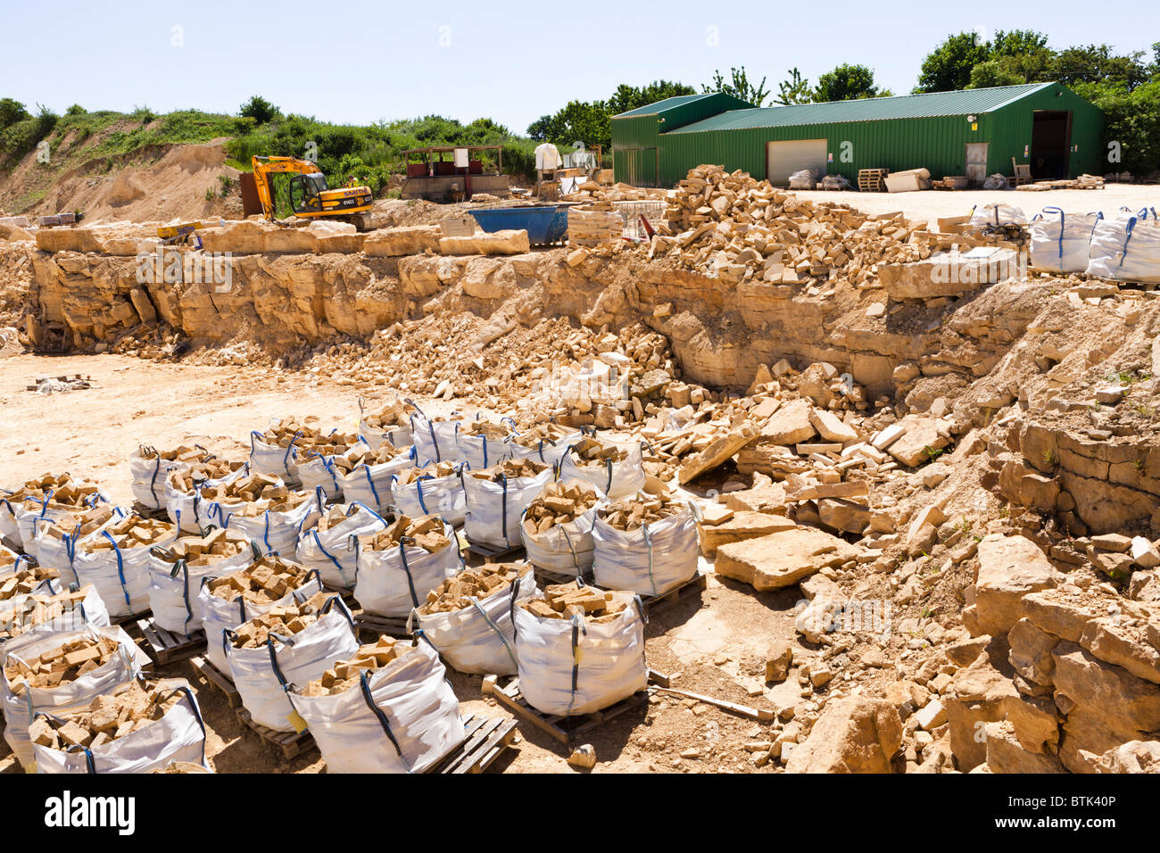 Cotswold oolitic limestone cut in blocks and made into packs of facing stone in the Cotswold Hill Quarry, Ford, Gloucestershire Stock Photo