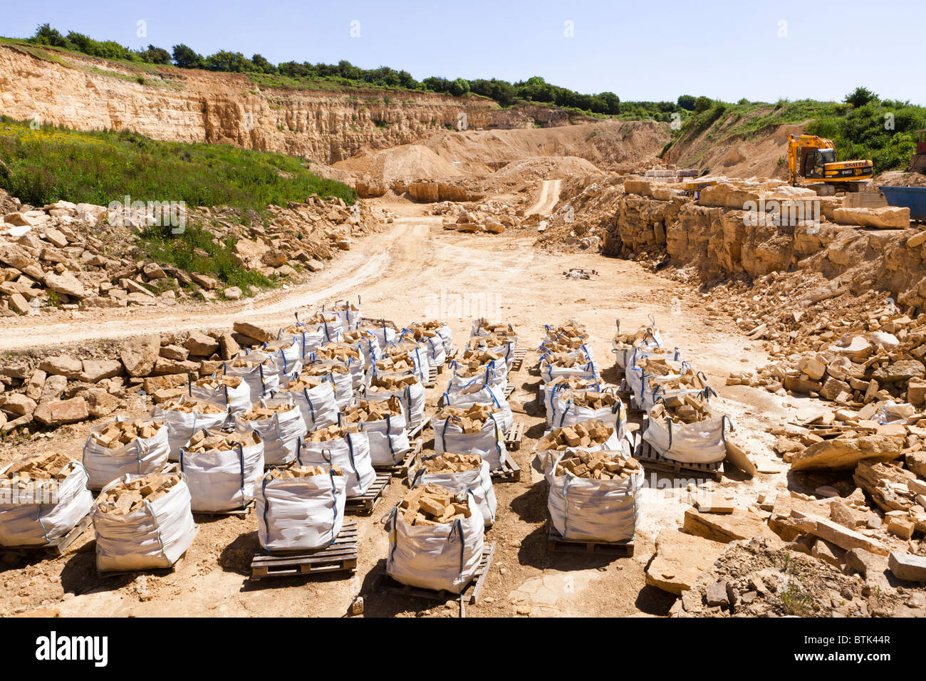 Cotswold oolitic limestone cut in blocks and made into packs of facing stone in the Cotswold Hill Quarry, Ford, Gloucestershire Stock Photo