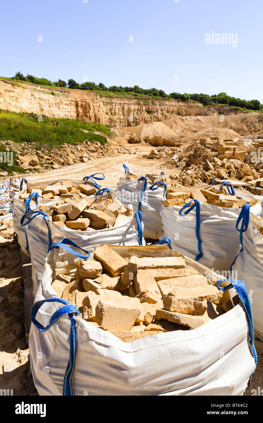 Cotswold oolitic limestone cut in blocks and made into packs of facing stone in the Cotswold Hill Quarry, Ford, Gloucestershire Stock Photo