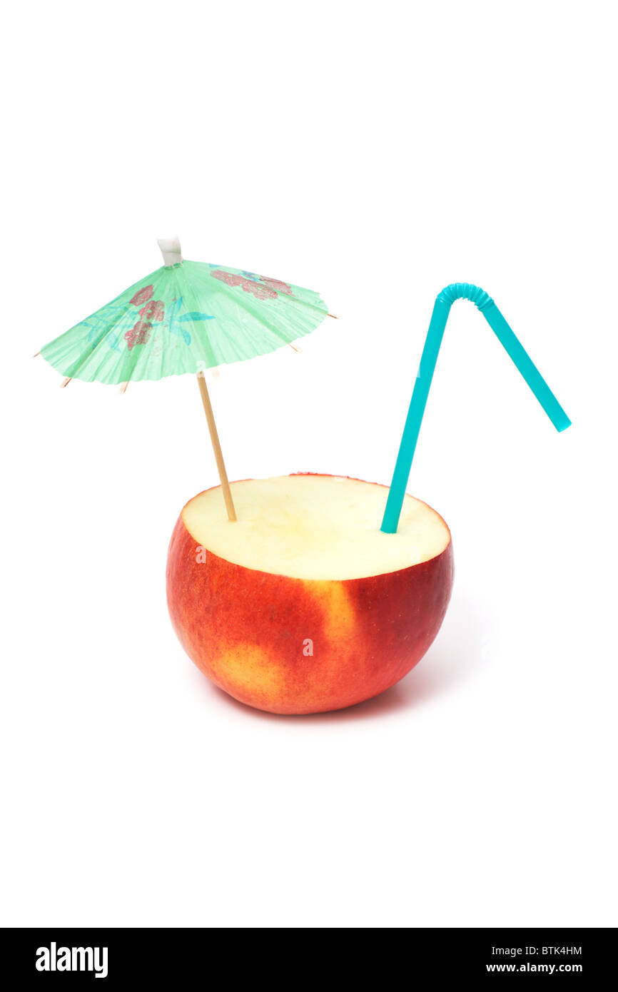 apple with umbrella and straw Stock Photo