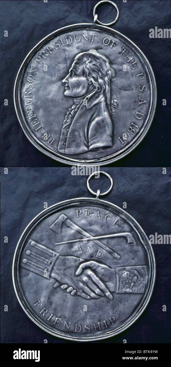 Thomas Jefferson Indian Peace Medal, relief portrait of President Thomas Jefferson in profile (obverse), clasped hands under crossed peace pipe and tomahawk (obverse). Silver coin, 1801 Stock Photo