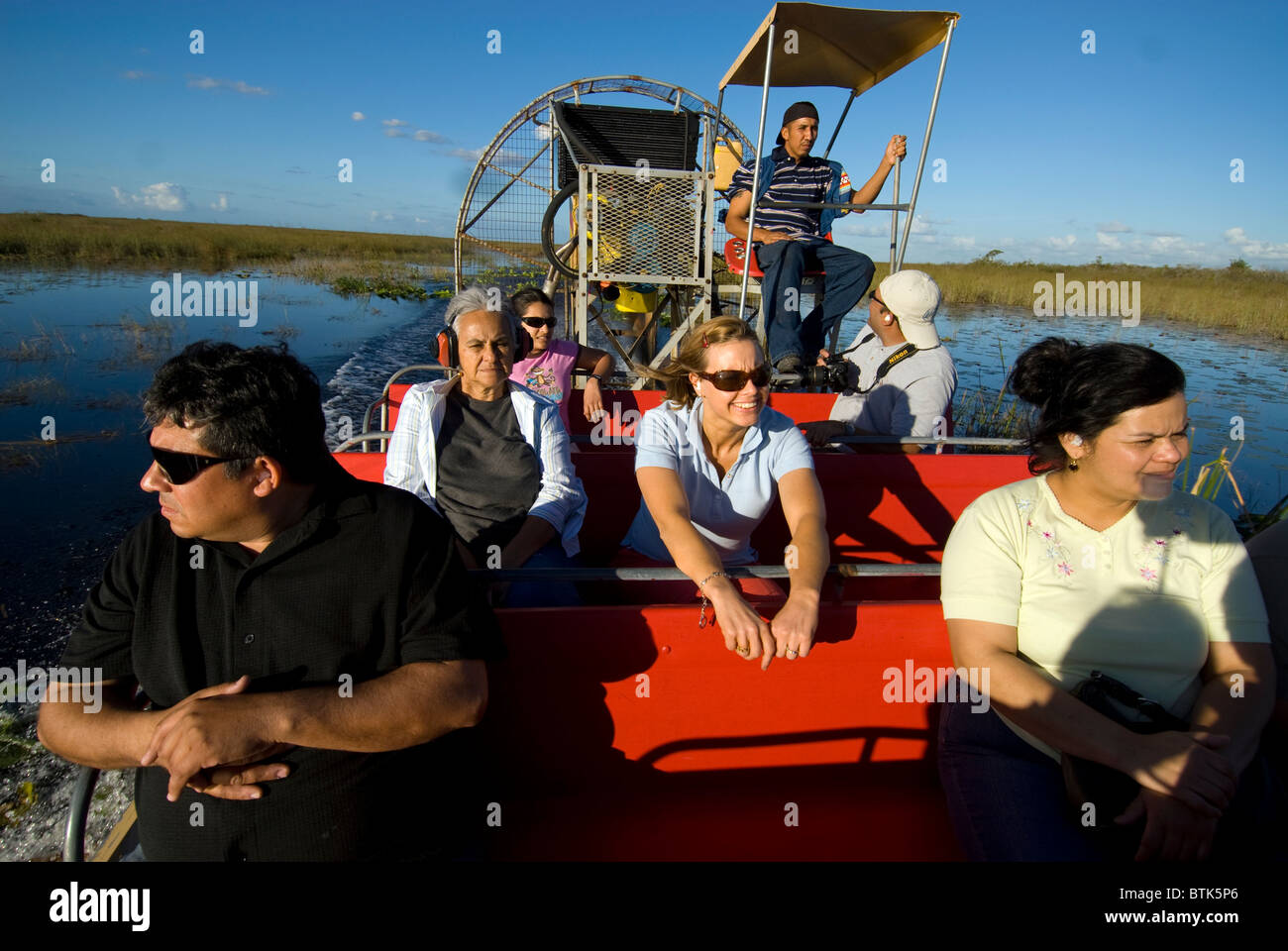 Tourists on airboat ride in Florida Everglades USA Stock Photo
