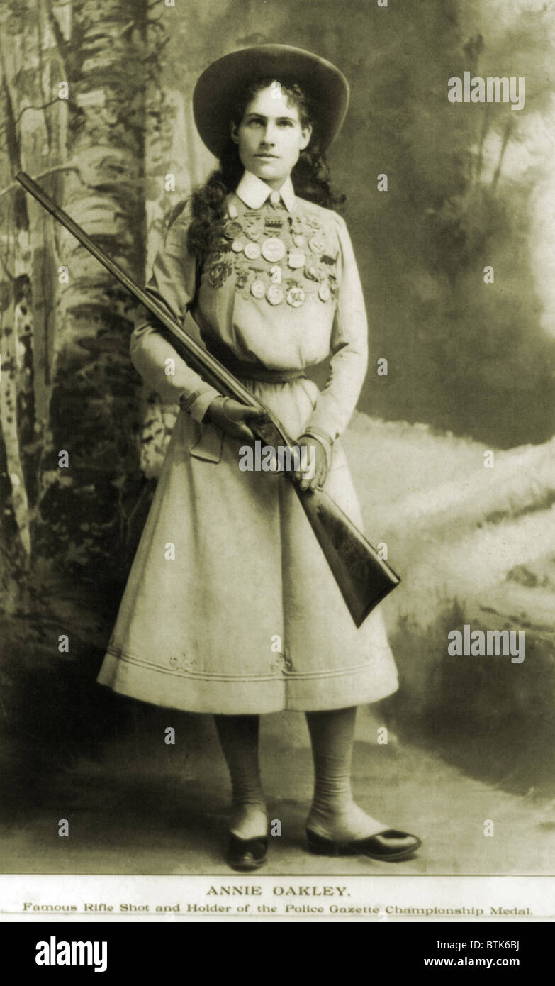 Annie Oakley (1860-1926) American sharpshooter bedecked with awards and  medals in 1899 Stock Photo - Alamy