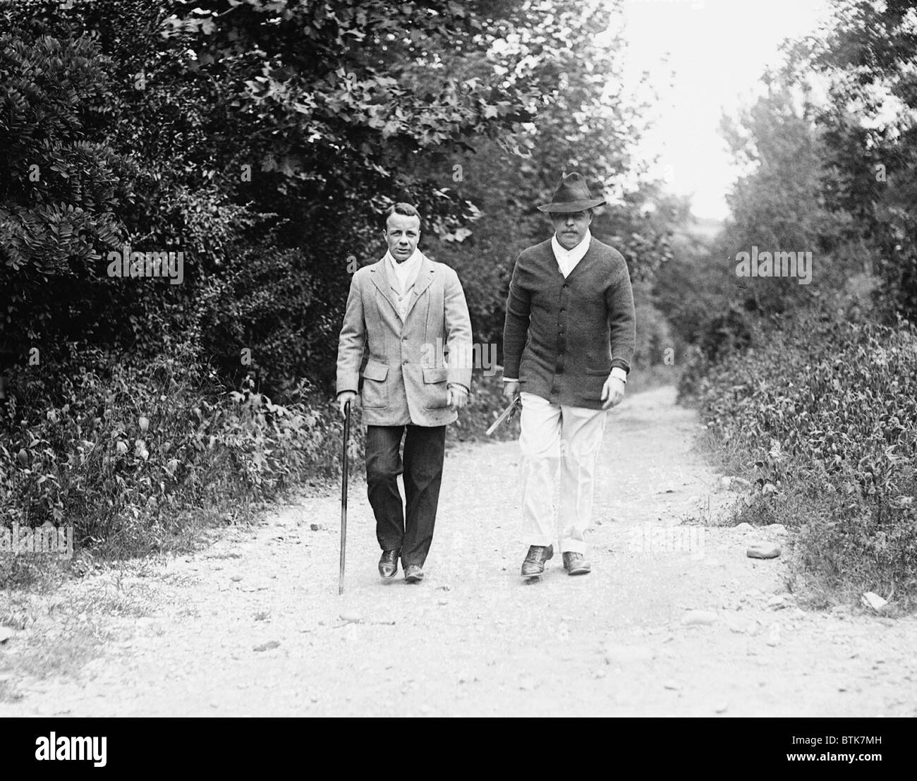 Representative Nicholas Longworth and his brother-in-law and fellow Republican Politician, Theodore Roosevelt Jr., taking a walk in the country. 1921. Stock Photo