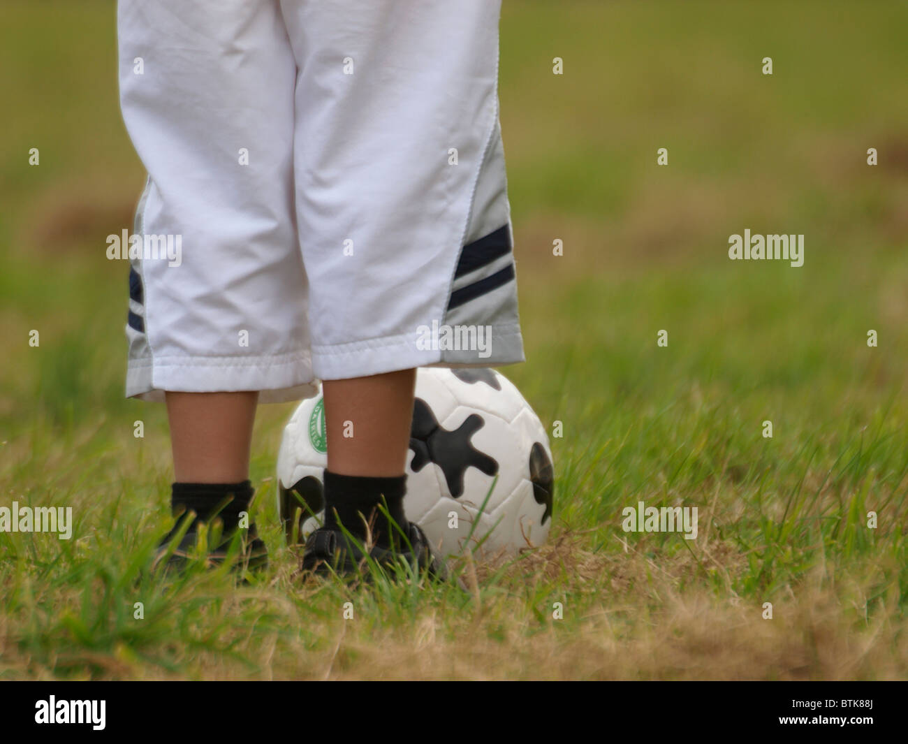 young boy with a football, UK Stock Photo