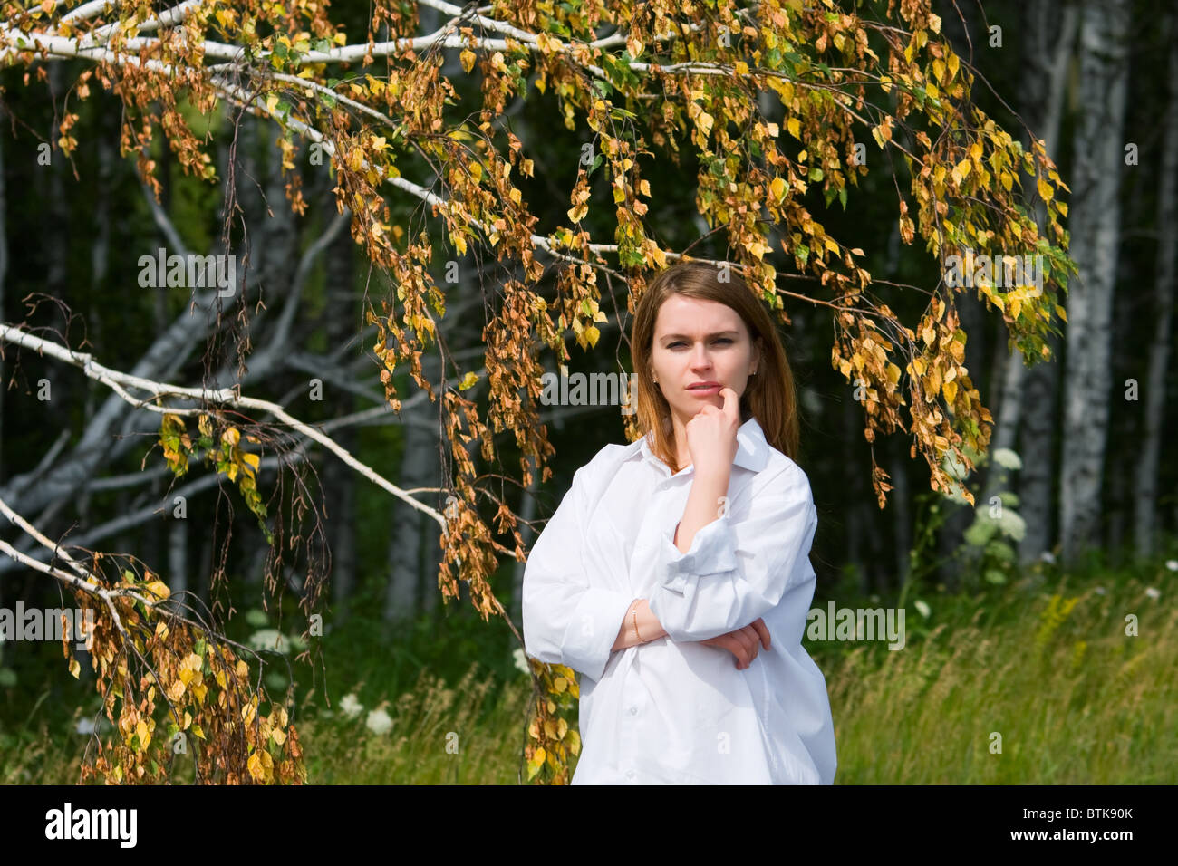 Young woman walking in the birch forest Stock Photo - Alamy