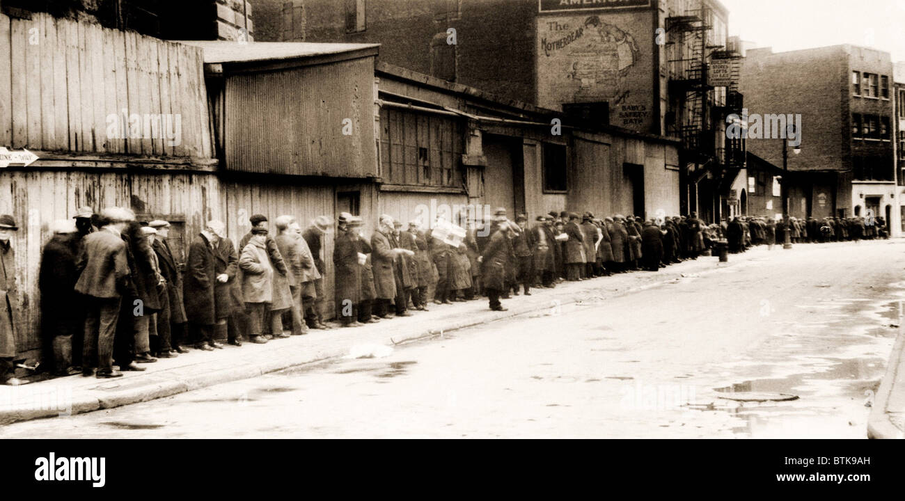 Great Depression breadline at McCauley Water Street Mission under Brooklyn Bridge, New York. 1932. Stock Photo