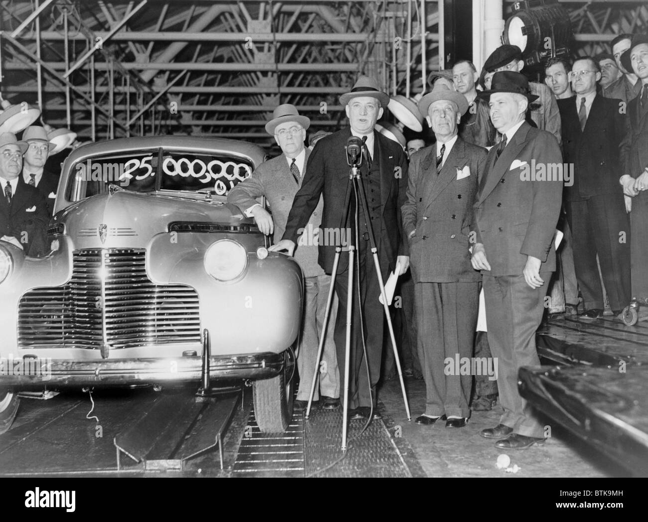 William S. Knudsen (1879-1948), presided over the 25,000,000th car to come off the General Motors had recently been named director of U.S. industrial production during World War II. Flint, Michigan 1940 Stock Photo