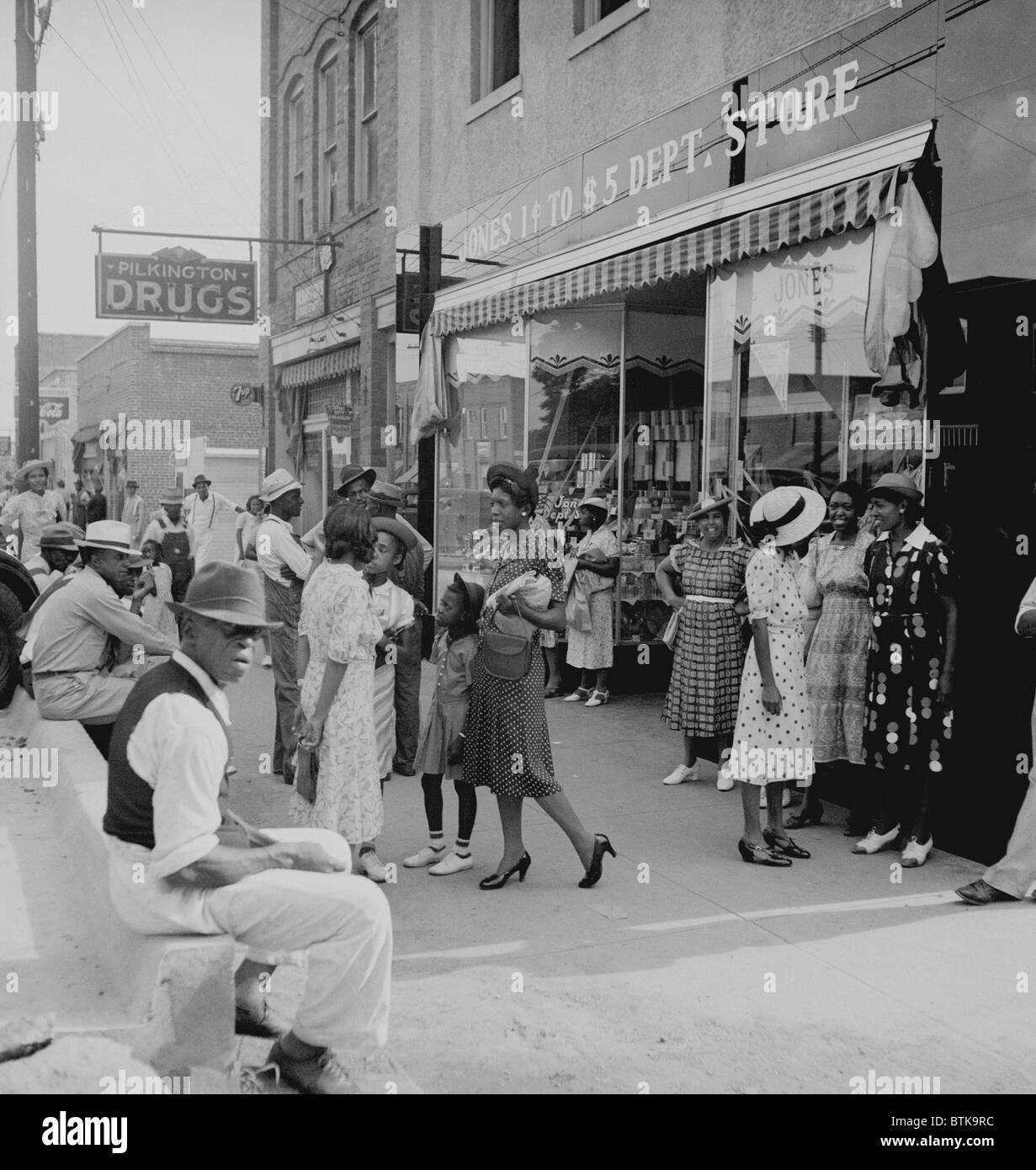 African Americans shopping and visiting on main street of Pittsboro, North Carolina. Dorothea Lange photo from 1939, shows an optimistic view of African American life in Jim Crow South. Stock Photo