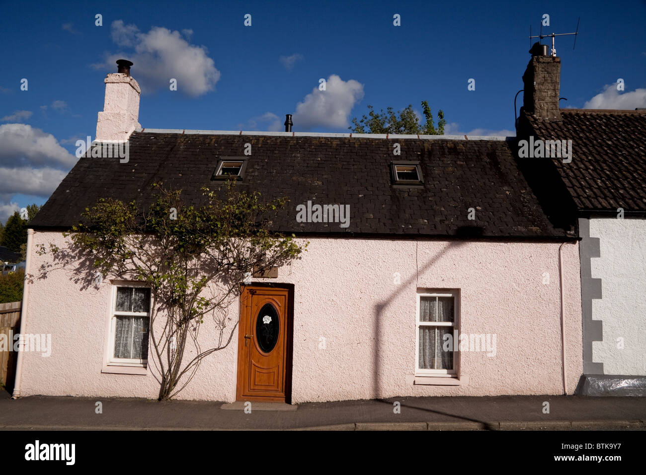Pink cottage in village of Killin Scotland Stock Photo