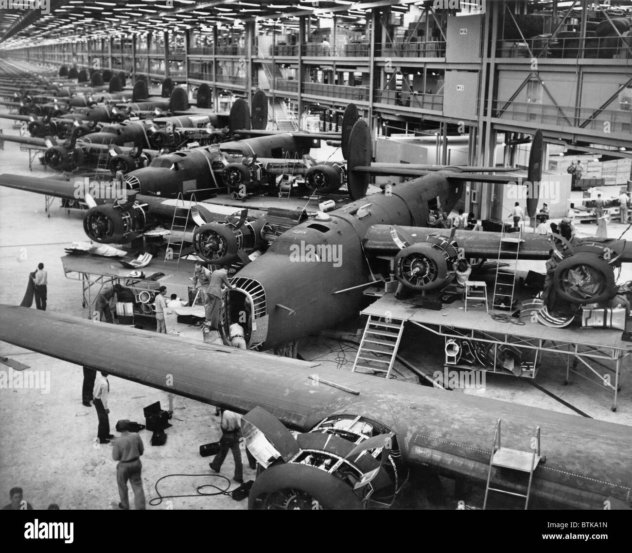 B-24 Liberator bombers nearing completion on the assembly line at the Consolidated Aircraft Corporation plant, Fort Worth, Texas. 1942. Stock Photo