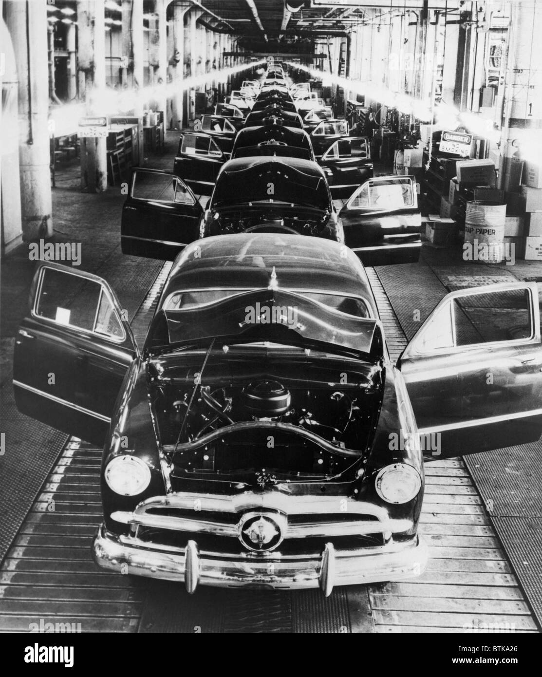 1949 Ford cars sit on a deserted assembly line during the 25 day strike called by the United Auto Workers to oppose Henry Ford II's imposition of automation and more efficient production standards. Stock Photo