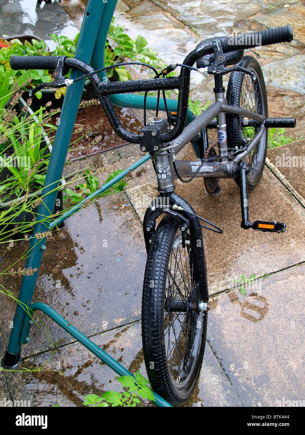 BMX bike in the rain, No play today, UK Stock Photo - Alamy