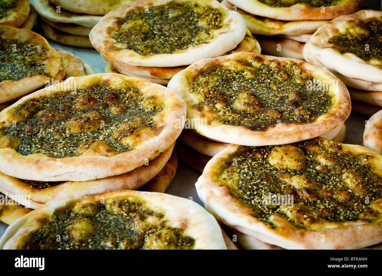 Manosha, arabian pizza, with sesame seeds, olive oil and coriander soem times also called Lahmacun  or lahmanjun Stock Photo