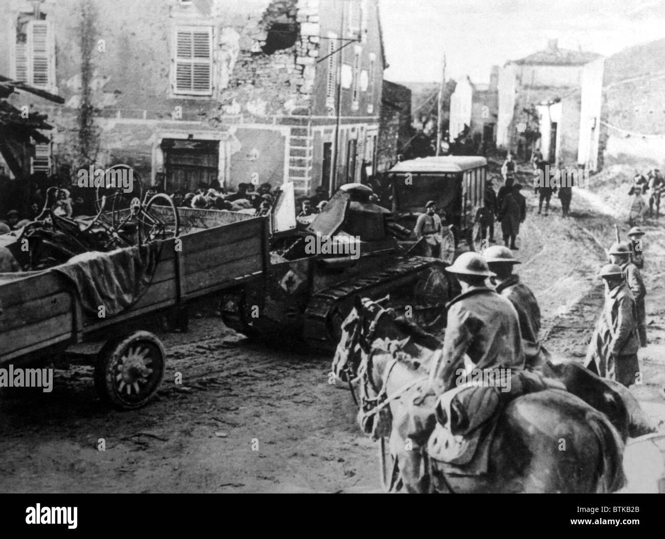 World War I, American tank hauling a truck filled with bicycles towards the front in the St. Mihiel salient in France, U.S. Signal Corps photograph, 1918 Stock Photo