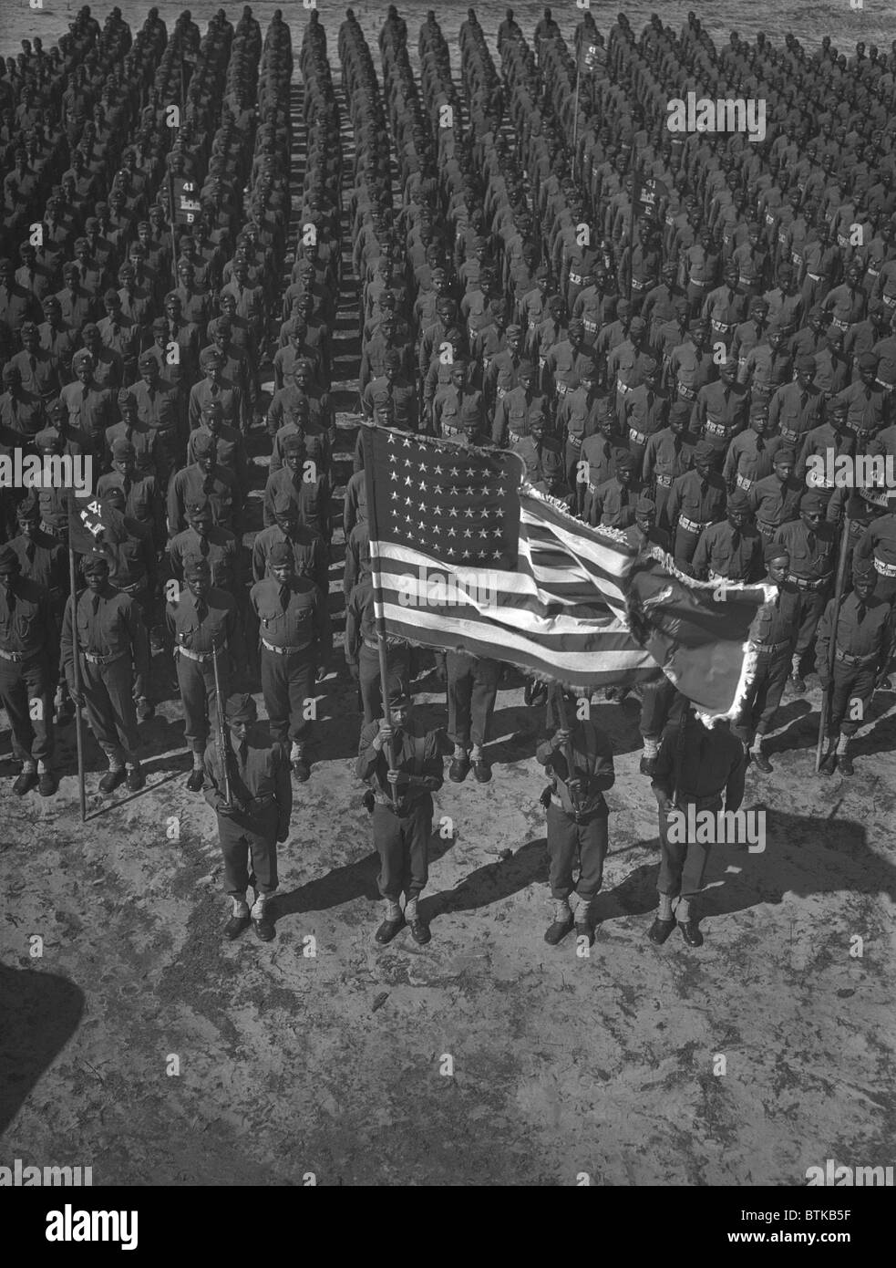 U.S. Army 41st Engineers on parade ground at Fort Bragg, North Carolina, March 1942. In the segregated army, many African Americans was assigned to engineer construction that built and repaired roads, airfields, and bridges. Stock Photo
