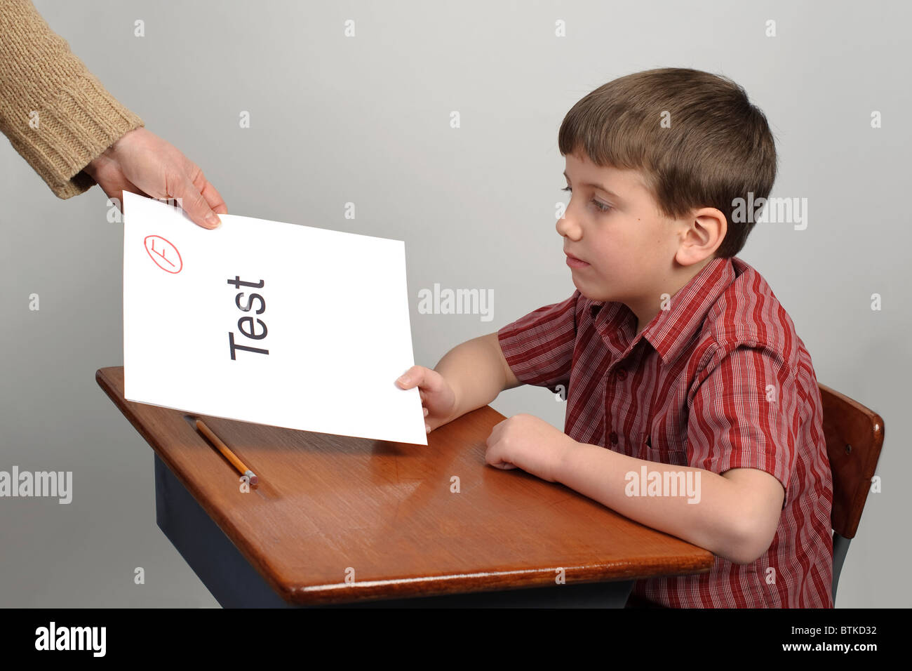 A boy receiving a failing test score Stock Photo