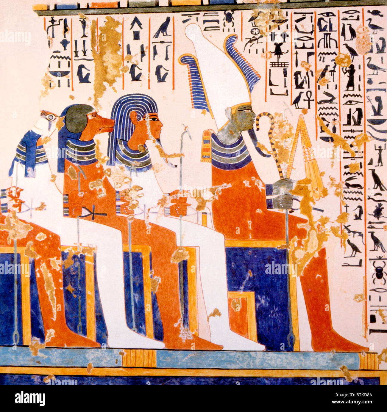 Painting of burial gods Kebehsenenuef, Hapi and Imseti with the god Isiris (right) in the tomb of Nebamun and Ipuki, ca. 1380 B.C. Stock Photo