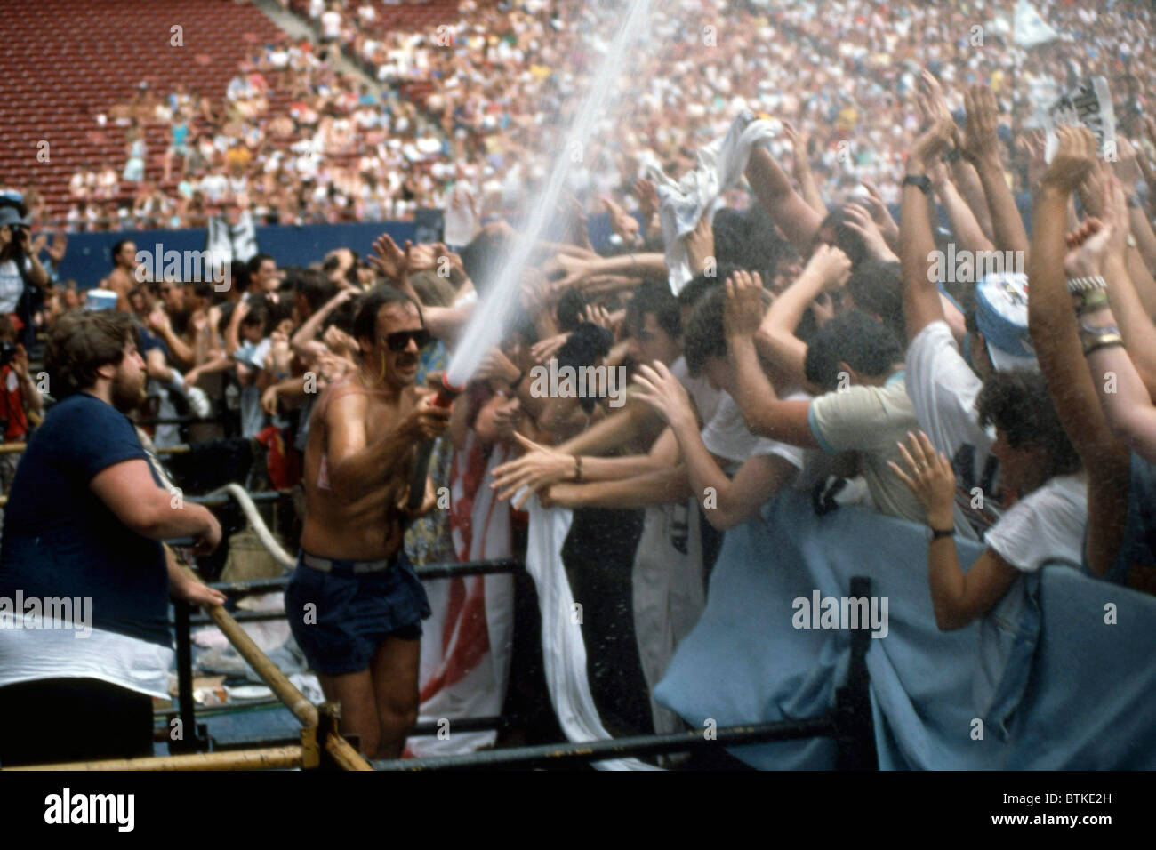 Fans Getting Hosed Off At The Concert For Amnesty International Giant Stadium New Jersey June 15 1986 Stock Photo Alamy