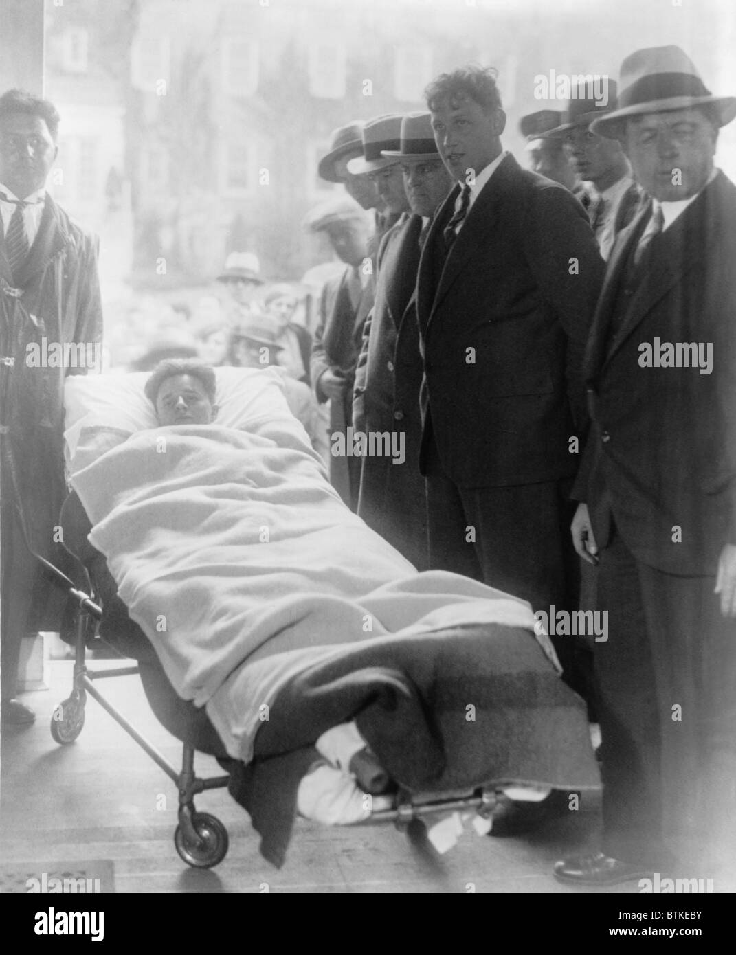 Francis 'Two Gun' Crowley (1911-1932), a robber and cop killer, arrives at his arraignment in a gurney, still recovering from the bullet wounds sustained during his capture by police. May 8, 1931. Stock Photo