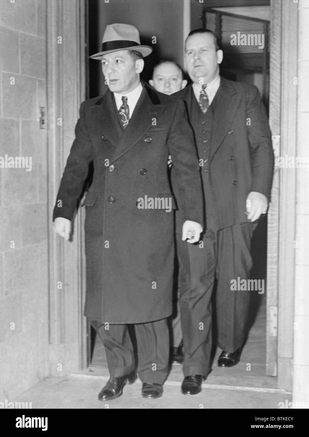 Louis 'Lepke' Buchalter (1897-1944), leaving the Federal court in New York City in December 1939. The Murder, Inc. boss was convicted of narcotics conspiracy. Future convictions for union racketeering and murder, resulted in his 1944 execution. Stock Photo