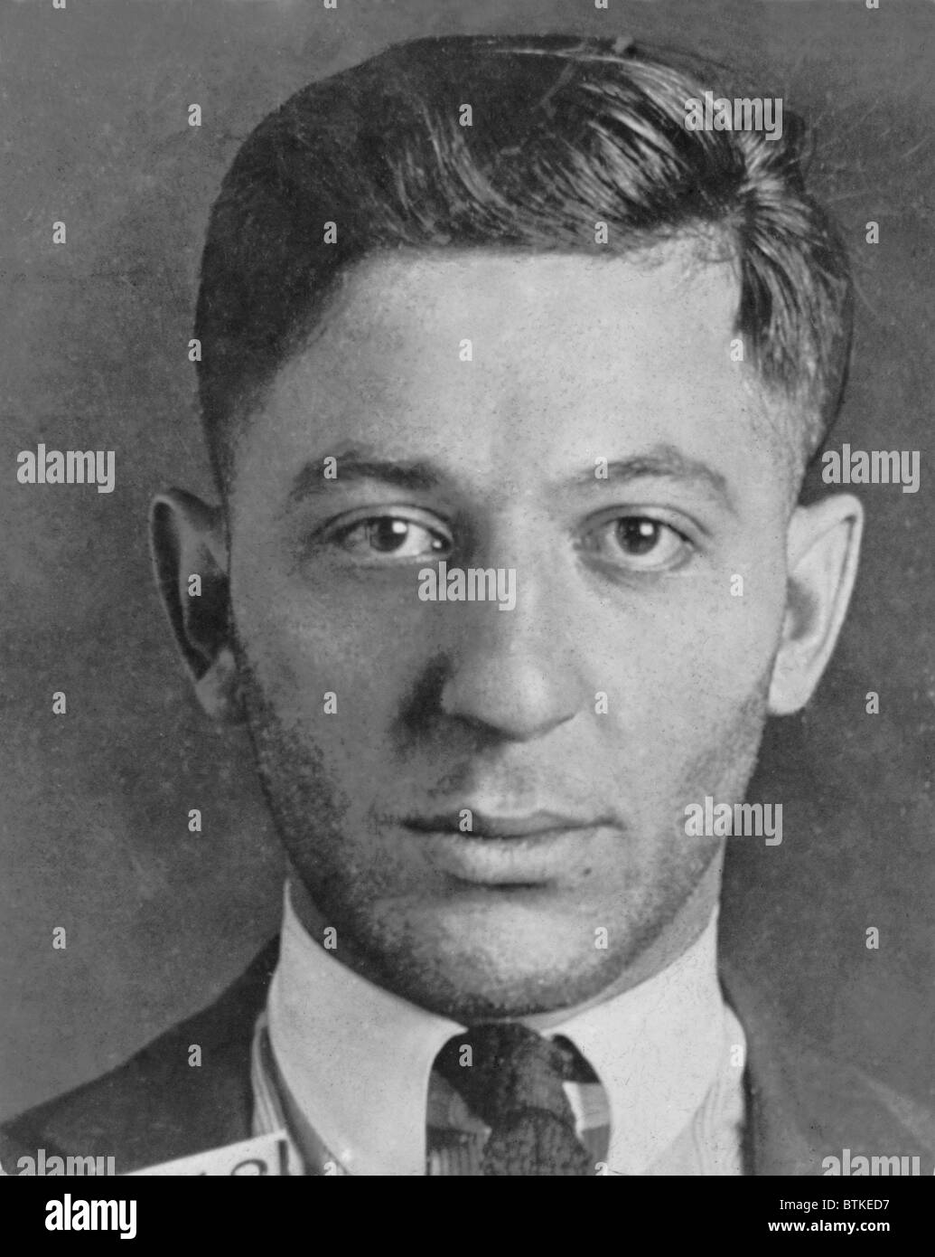 Louis 'Lepke' Buchalter (1897-1944) in police custody in August 1939.  The following year the head of Murder Inc. was convicted Stock Photo