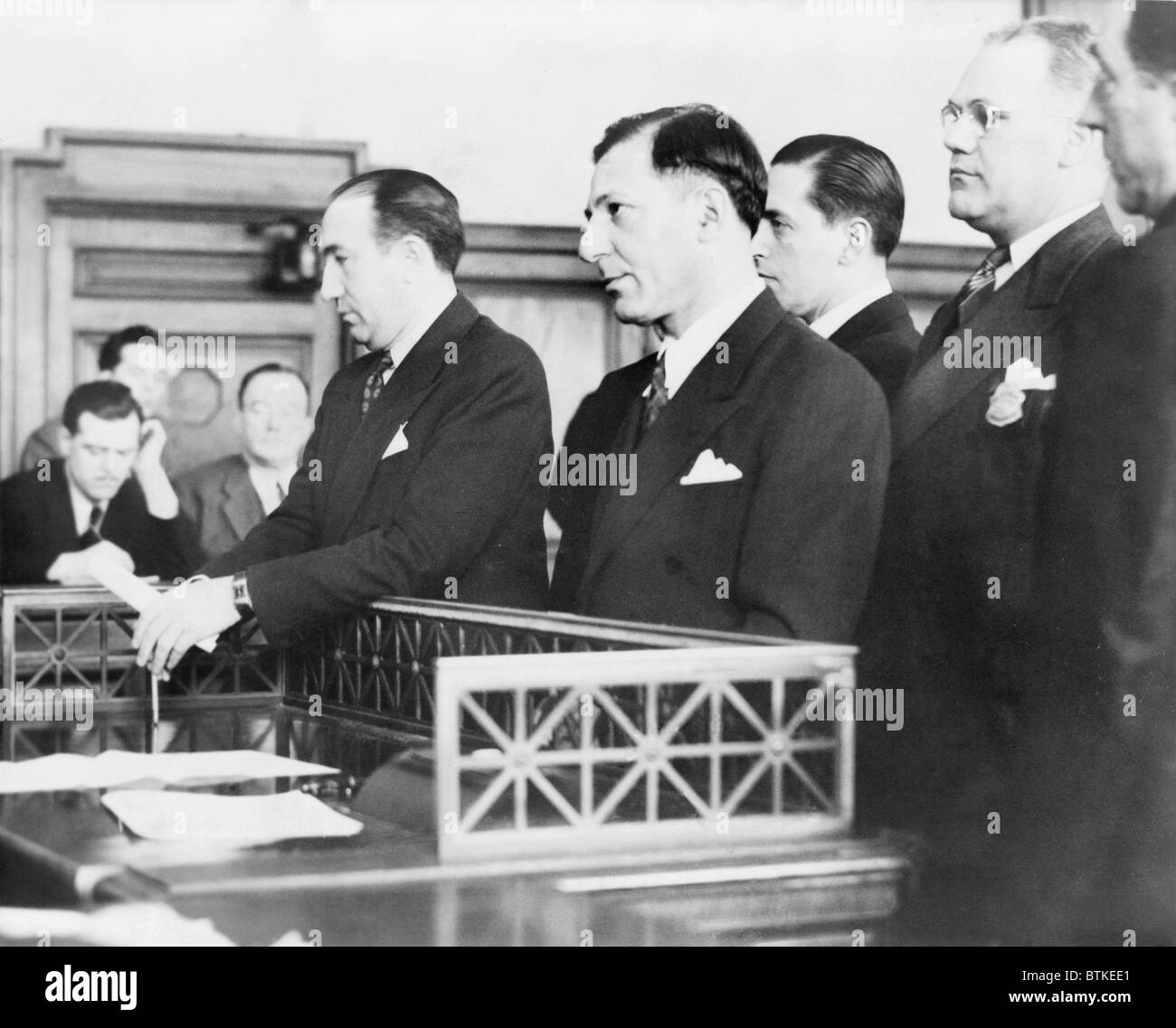 Louis 'Lepke' Buchalter, standing in court during sentencing to 14 years in prison for narcotics conspiracy on December 5, 1941. Thirty years would be added for labor racketeering. In another trial, for the murder of James Rosen, he would be executed in 1944. Stock Photo