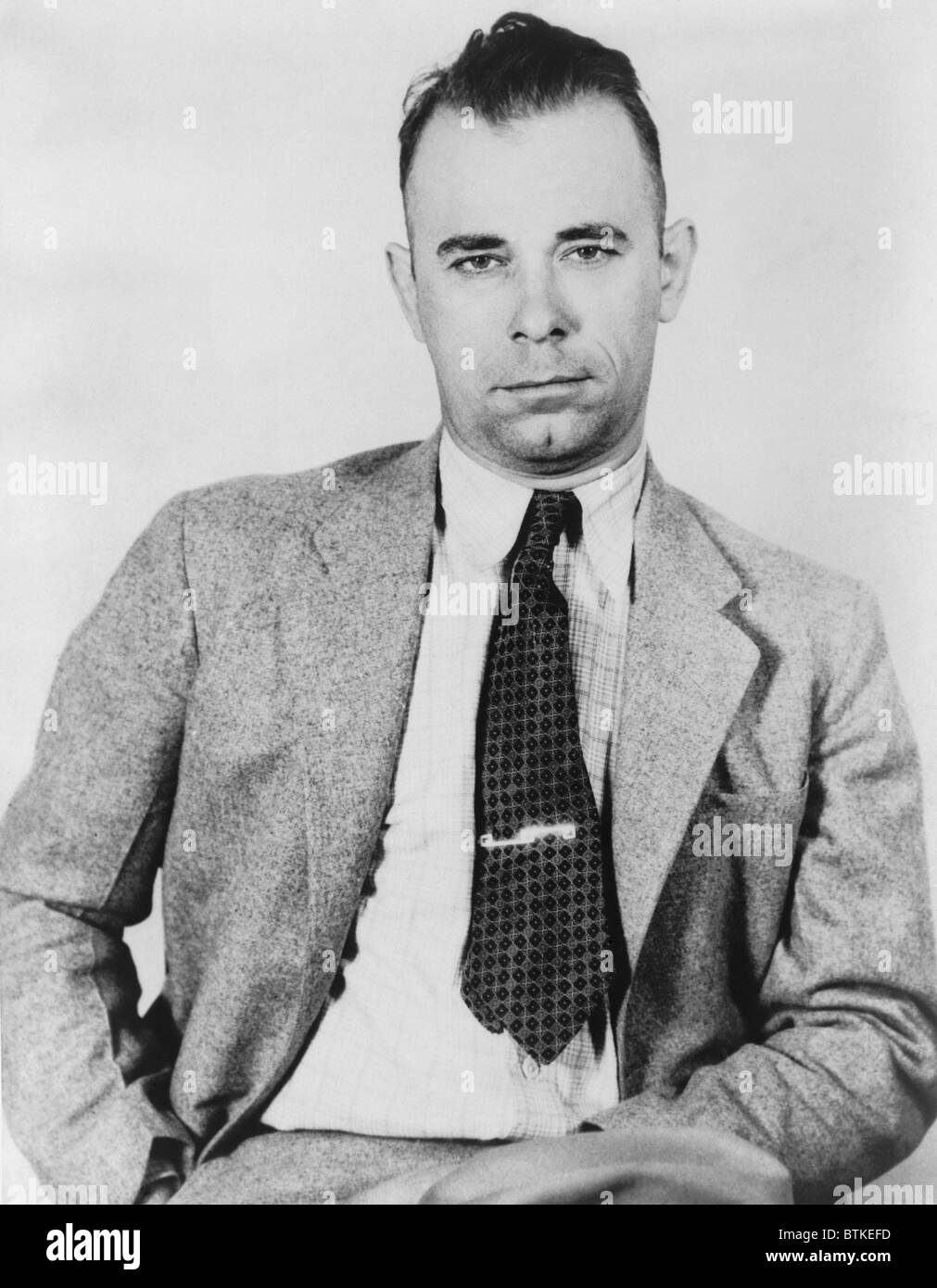 John Dillinger (1903-1934), famous bank robber, in police custody in September 1933, would soon be freed by five former convict Stock Photo