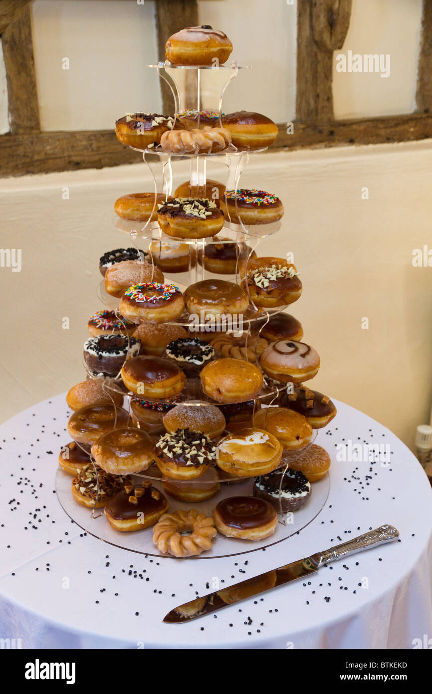 Tiered [wedding cake] made from doughnuts / donuts Stock Photo