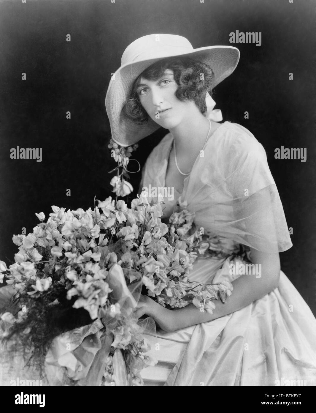 Cornelia Stuyvesant Vanderbilt (1900-1976), only child of George W. Vanderbilt and Edith Stuyvesant Dresser holding a bouquet of flowers on the announcement of her engagement to British diplomat, John Francis Amherst Cecil. The couple had two sons before their 1934 divorce. Stock Photo