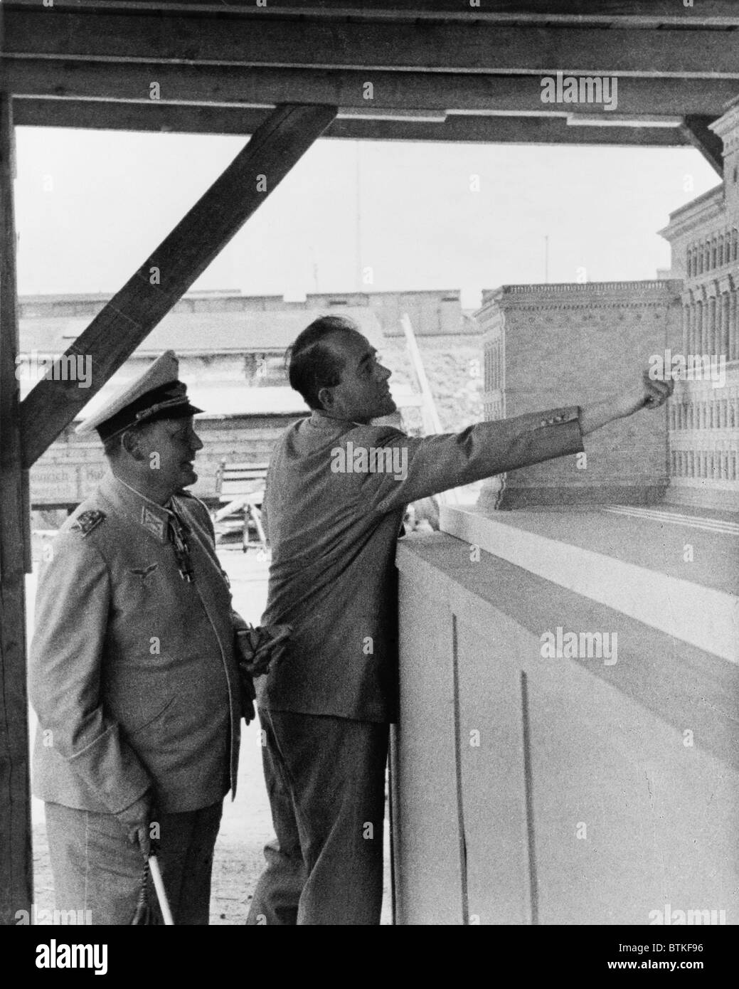 Albert Speer (1905-1981), Adolf Hitler's favored architect, pointing out details of an architectural model for Reichsmarschall ministry to Hermann Goring (1893-1946). Stock Photo
