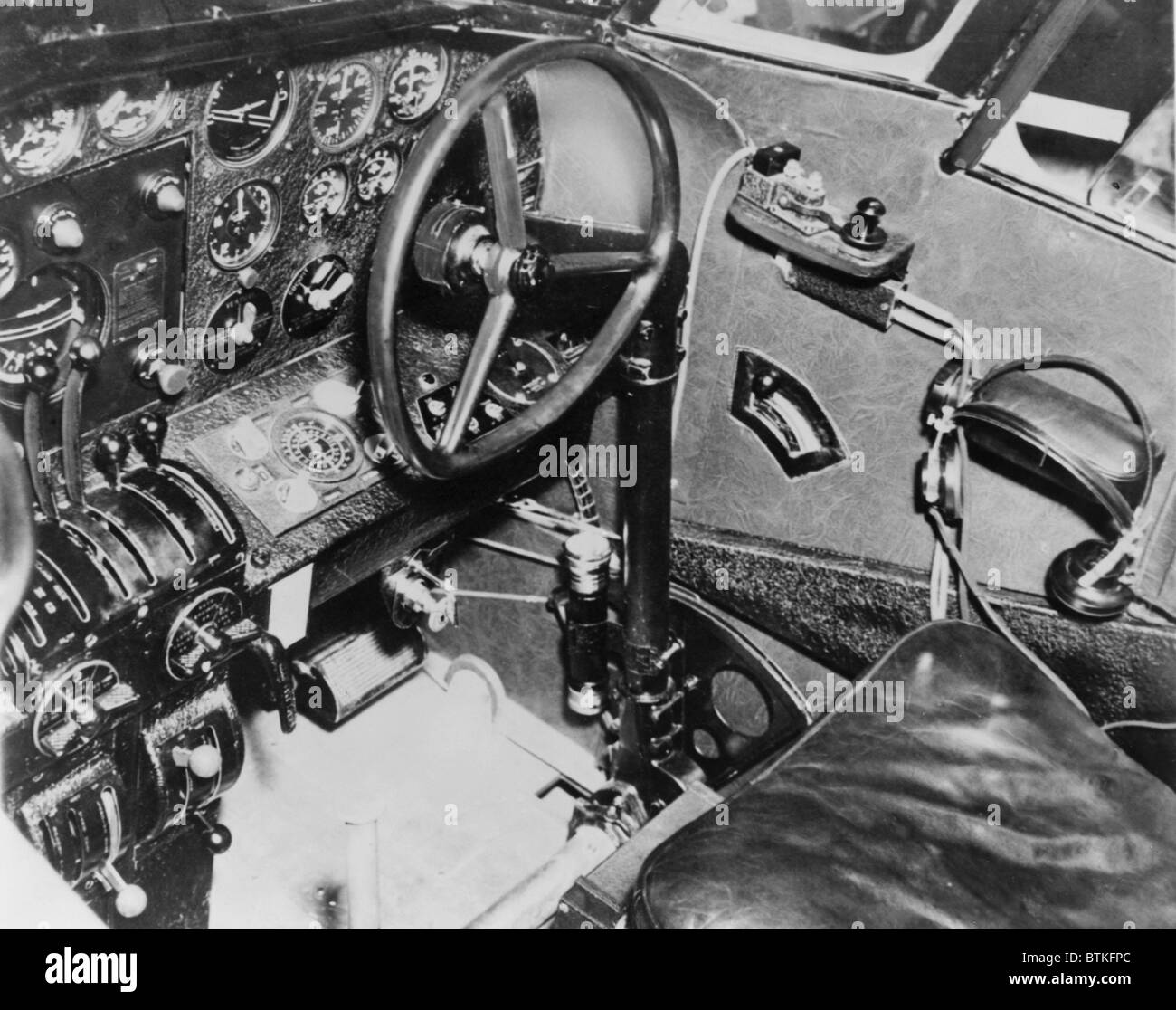 Cockpit of Amelia Earhart's plane, a Lockheed L-10E Electra, showing the transmitter key from which she transmitted an urgent SOS from somewhere in the central Pacific Ocean where her plane vanished on July 2, 1937. Stock Photo