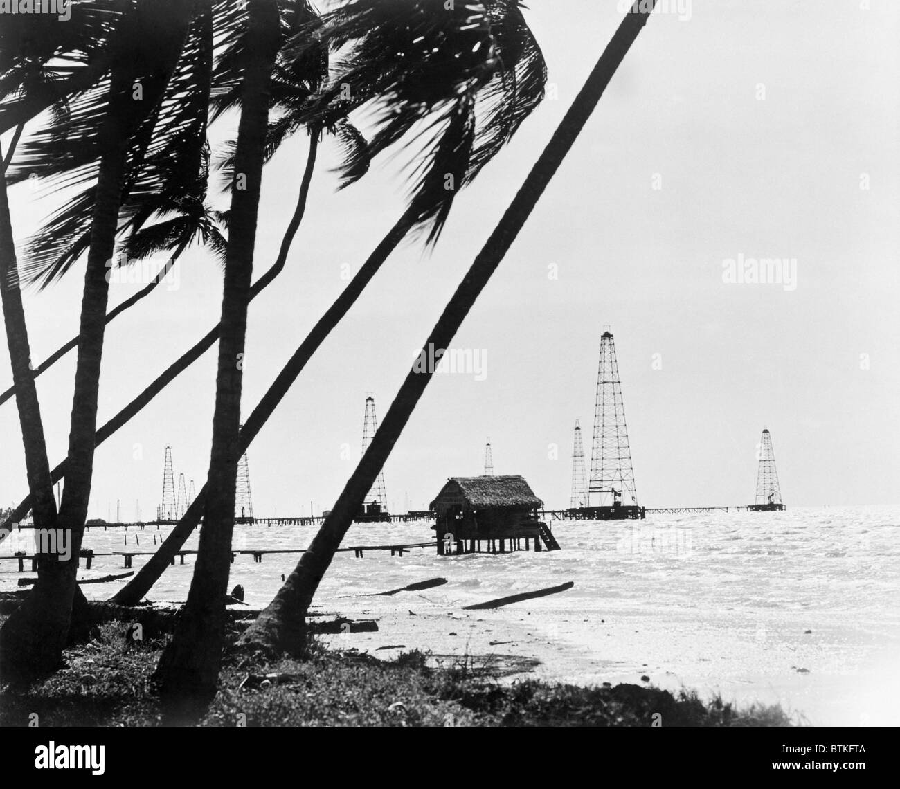 Oil derricks off the shore in Maracaibo Lake, Venezuela owned by Standard Oil Corporation of New Jersey. 1944. Stock Photo