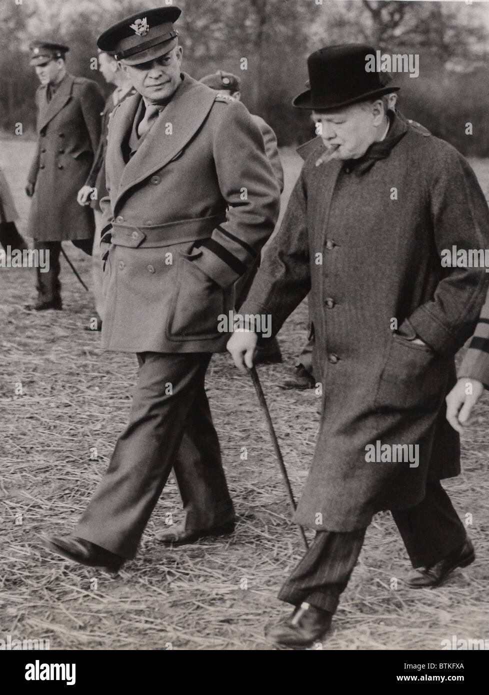 General Dwight Eisenhower, and Prime Minister Winston Churchill inspect a U.S. glider and paratroop invasion demonstration prior to the D-Day invasion of Normandy in 1944. Stock Photo